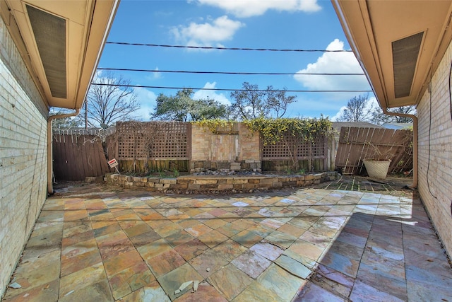 view of patio featuring a fenced backyard