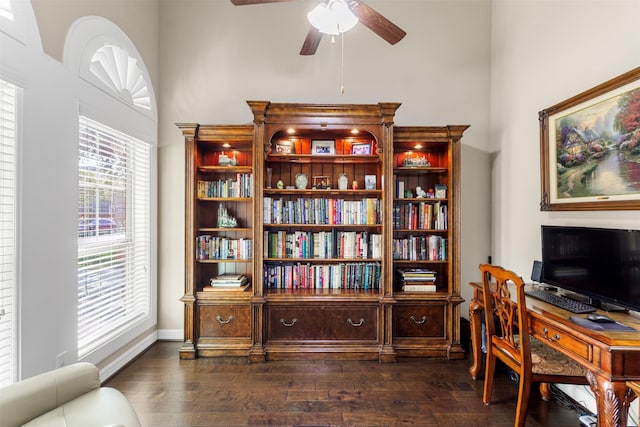 office area featuring baseboards, dark wood finished floors, and a ceiling fan