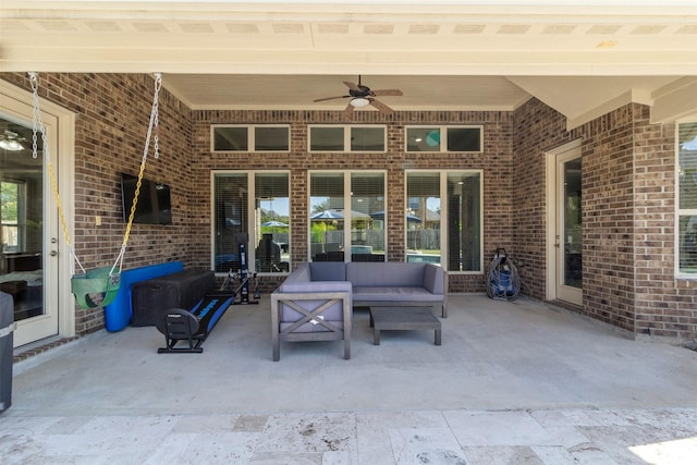 view of patio / terrace with ceiling fan and an outdoor living space