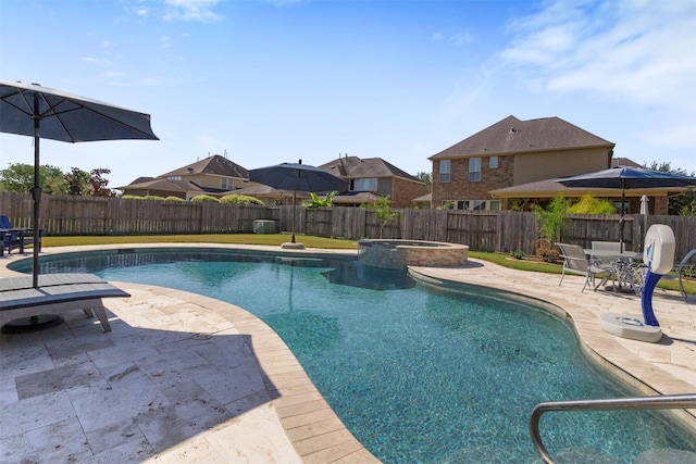 view of swimming pool with a patio, a fenced backyard, and a pool with connected hot tub