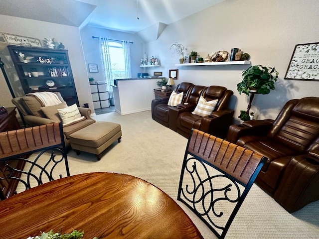 living room with lofted ceiling and carpet