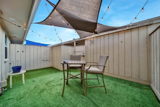 view of patio / terrace featuring fence