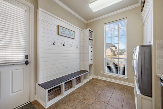 mudroom with ornamental molding, light tile patterned flooring, and baseboards