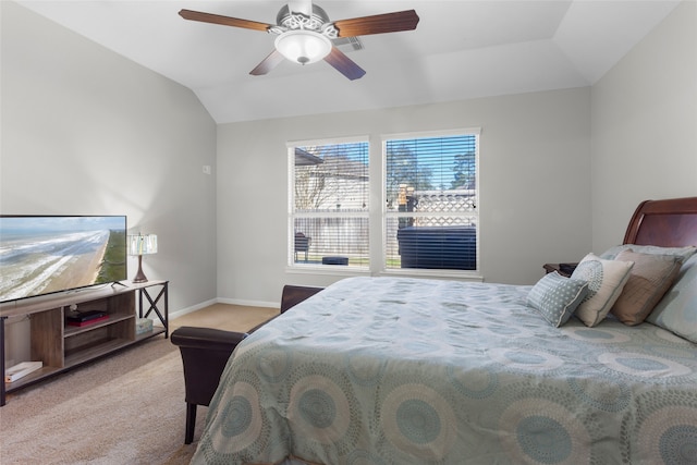 carpeted bedroom featuring ceiling fan, baseboards, and vaulted ceiling