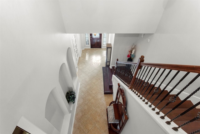 8707 Rolling Rapids Rd, Humble, TX 77346 - stairway with tile patterned flooring and baseboards