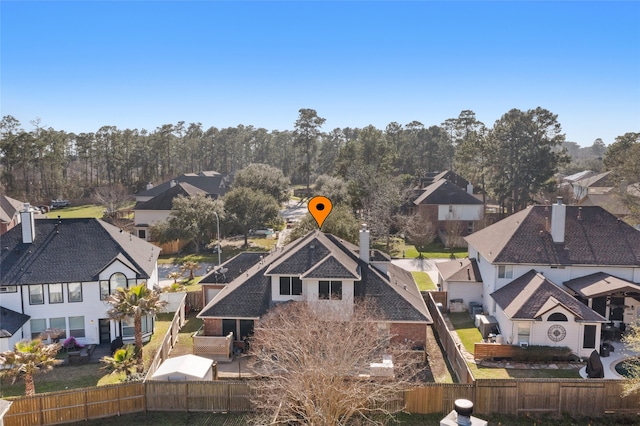 birds eye view of property with a residential view