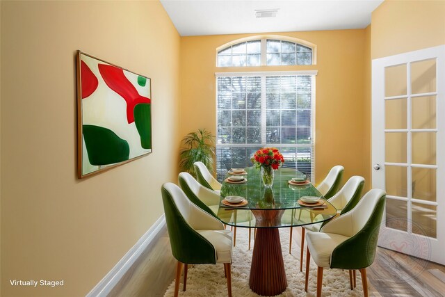 8707 Rolling Rapids Rd, Humble, TX 77346 - dining area with baseboards and wood finished floors