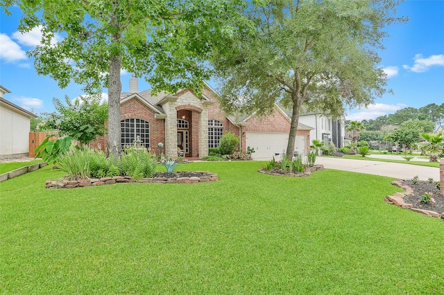 8707 Rolling Rapids Rd, Humble, TX 77346 - view of front of house featuring concrete driveway, a chimney, brick siding, and a garage