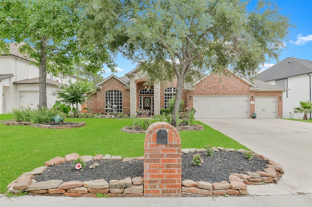 8707 Rolling Rapids Rd, Humble, TX 77346 - view of front facade featuring a front lawn, an attached garage, driveway, and brick siding