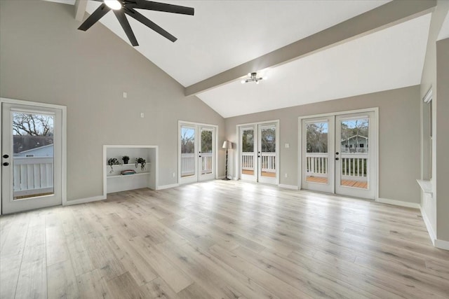 unfurnished living room with french doors, a wealth of natural light, and light wood-style floors