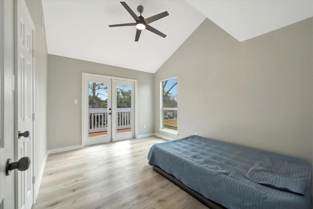 bedroom featuring access to exterior, french doors, high vaulted ceiling, light wood-type flooring, and baseboards