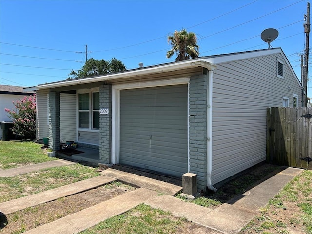 garage with fence