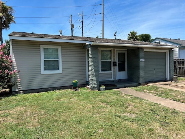 single story home with a garage, fence, and a front yard