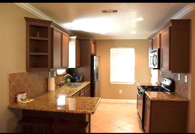 kitchen with stainless steel appliances, a sink, visible vents, ornamental molding, and open shelves