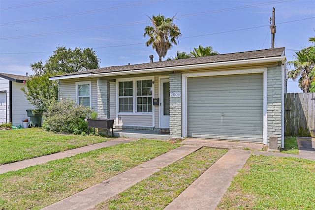 2009 Neumann Dr, Galveston, TX 77551 - view of front of house featuring a garage