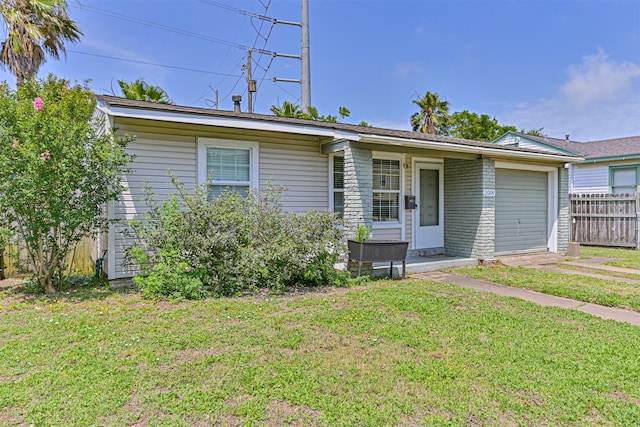 2009 Neumann Dr, Galveston, TX 77551 - ranch-style home featuring an attached garage and brick siding