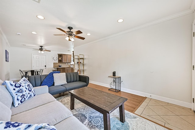 2009 Neumann Dr, Galveston, TX 77551 - living room featuring ornamental molding, recessed lighting, baseboards, ceiling fan, and light wood-style floors
