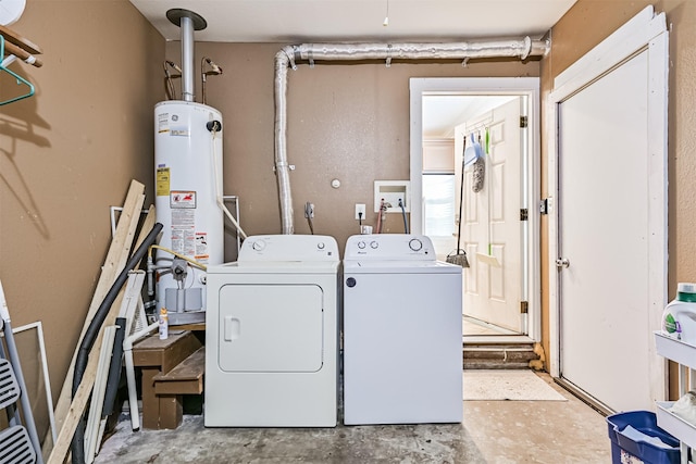 2009 Neumann Dr, Galveston, TX 77551 - laundry area featuring washing machine and clothes dryer and gas water heater