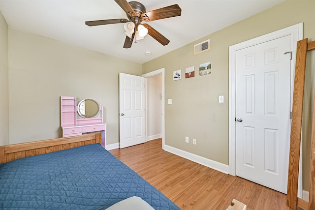2009 Neumann Dr, Galveston, TX 77551 - bedroom featuring light wood-style flooring, baseboards, and ceiling fan