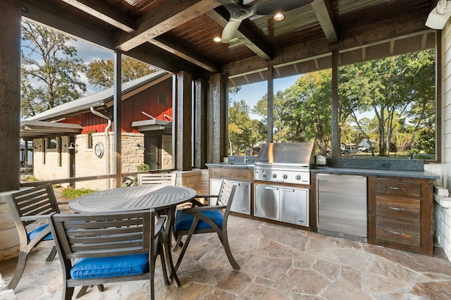 view of patio / terrace with outdoor dining area, ceiling fan, grilling area, and area for grilling