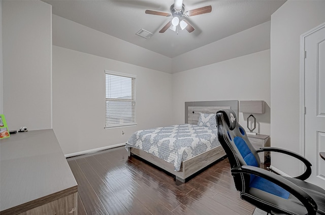 bedroom featuring dark wood-style floors, ceiling fan, and visible vents