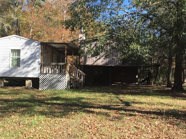 exterior space featuring stairway and a wooden deck