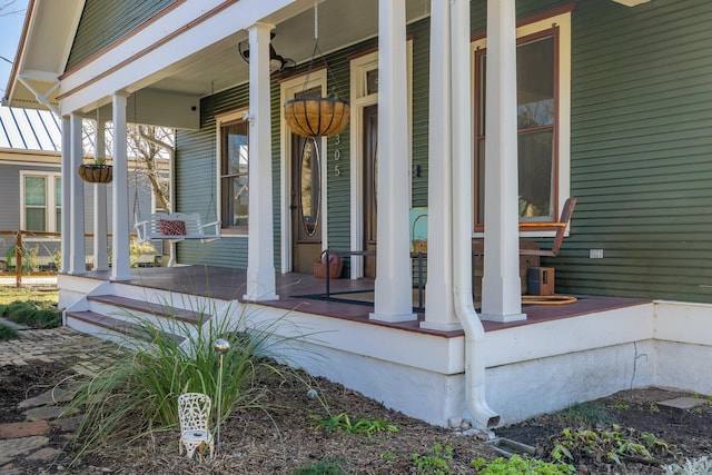 property entrance with covered porch