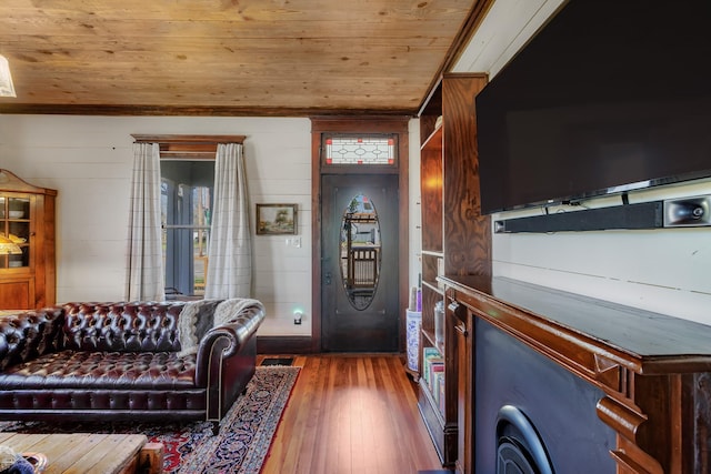 living area with wood ceiling and wood-type flooring