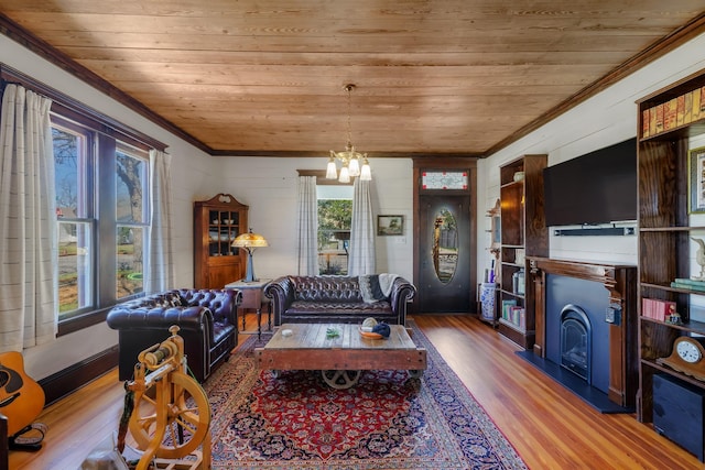 living room with a wealth of natural light, wood ceiling, and wood finished floors