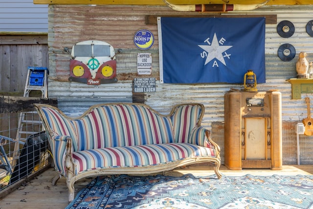 living area featuring rustic walls and wood finished floors