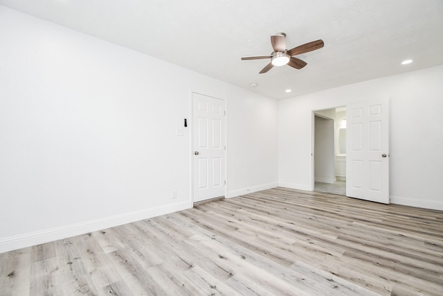 empty room with light wood-type flooring, ceiling fan, baseboards, and recessed lighting