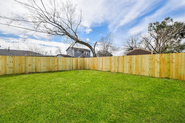 view of yard featuring a fenced backyard