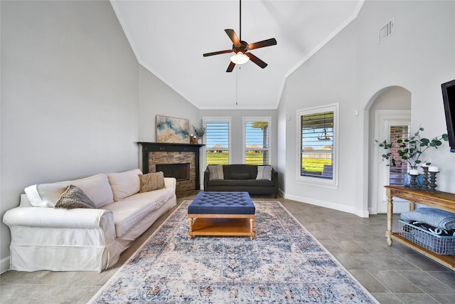 living room featuring a fireplace, visible vents, ceiling fan, high vaulted ceiling, and baseboards