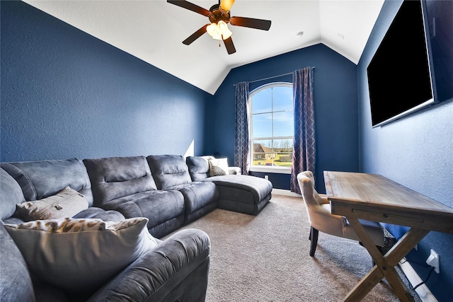 carpeted living area with lofted ceiling, ceiling fan, and a textured wall