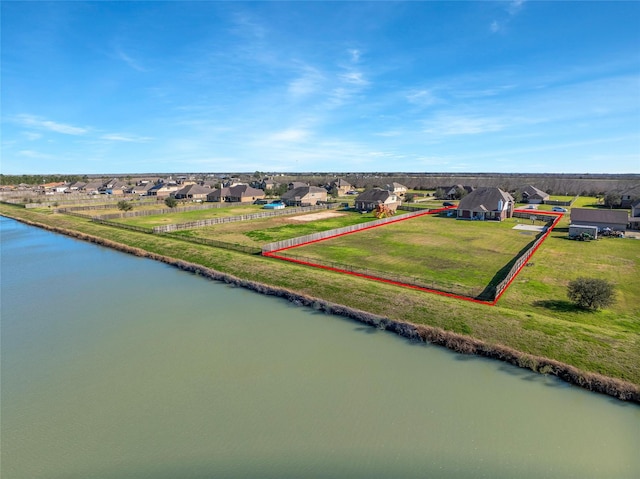 bird's eye view with a residential view and a water view