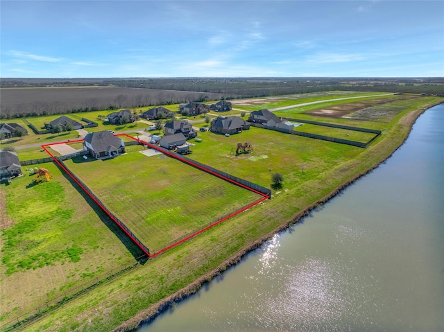 bird's eye view with a rural view and a water view