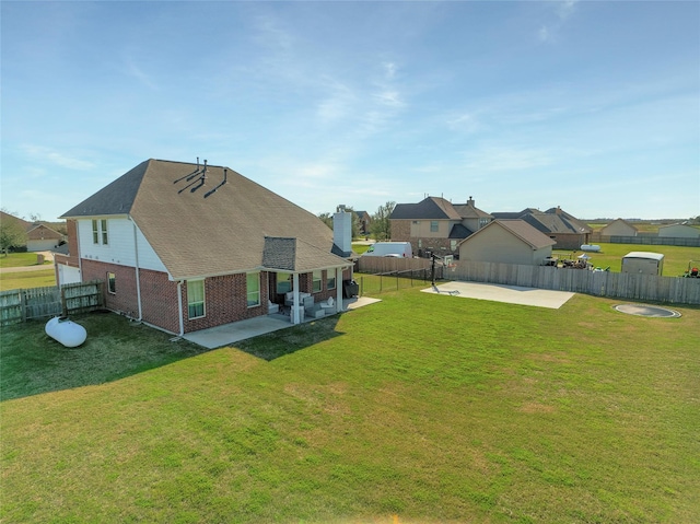 view of yard with a fenced backyard and a patio