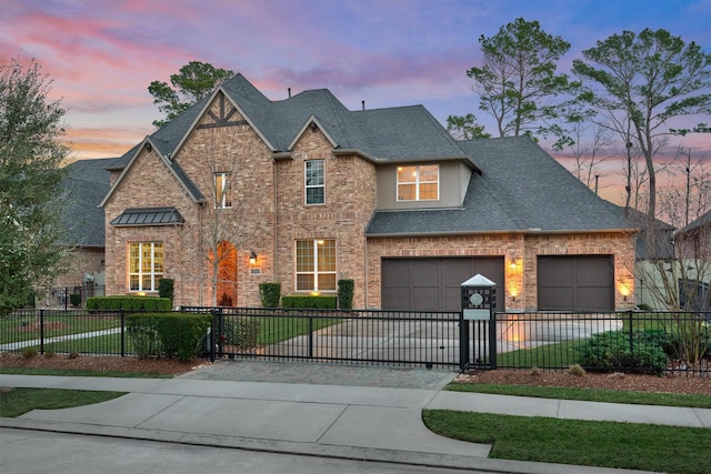 view of front of house with a fenced front yard, decorative driveway, and brick siding