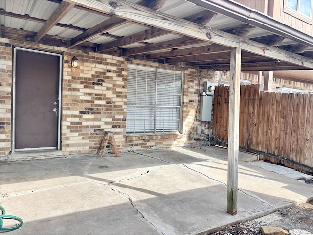 view of patio featuring fence