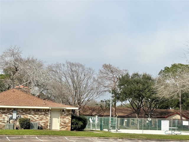 surrounding community with uncovered parking and fence