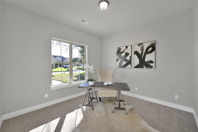 home office featuring baseboards, visible vents, and carpet floors