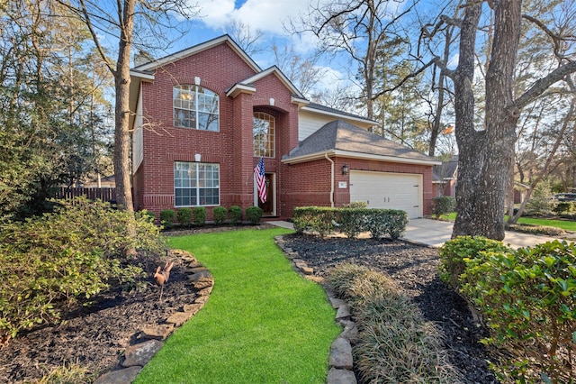 traditional-style house featuring concrete driveway, brick siding, an attached garage, and a front yard