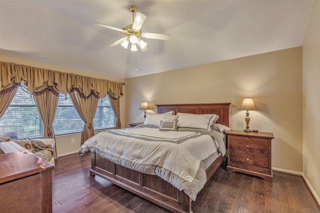 bedroom with multiple windows, baseboards, and wood finished floors