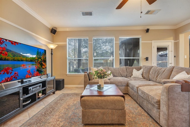 living area with ornamental molding, visible vents, and ceiling fan