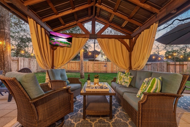 view of patio / terrace with a gazebo, outdoor lounge area, and a fenced backyard