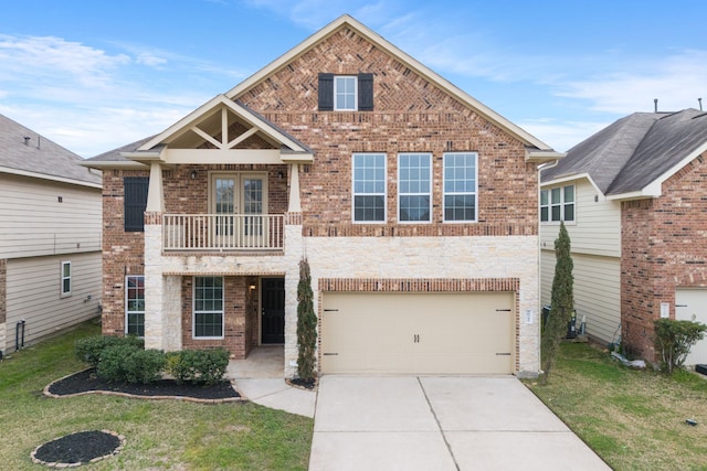 view of front of home with a balcony, a front lawn, concrete driveway, and brick siding