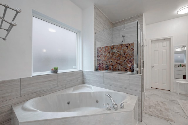 full bathroom with a whirlpool tub and a stall shower