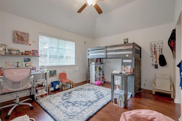 bedroom featuring lofted ceiling, wood finished floors, a ceiling fan, and baseboards