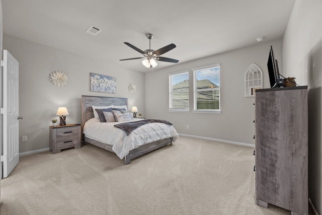 bedroom with ceiling fan, carpet floors, visible vents, and baseboards