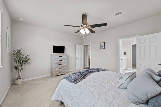 bedroom featuring light colored carpet, ceiling fan, visible vents, and baseboards